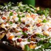 Loaded sheet pan nachos with traditional mexican styled toppings