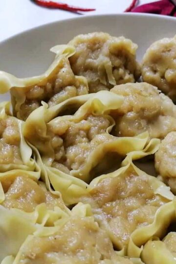 Indonesian version fish dumplings Siomay with a bowl of spicy peanut sauce.