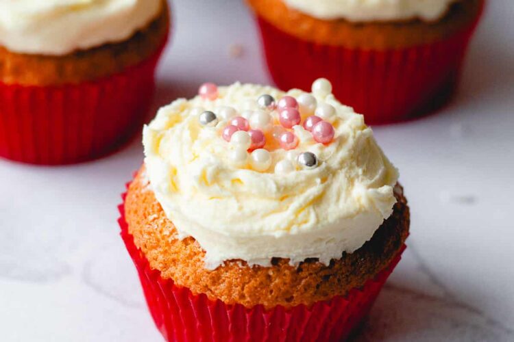 Buttercream icing with tiny pink and silver balls for decoration.