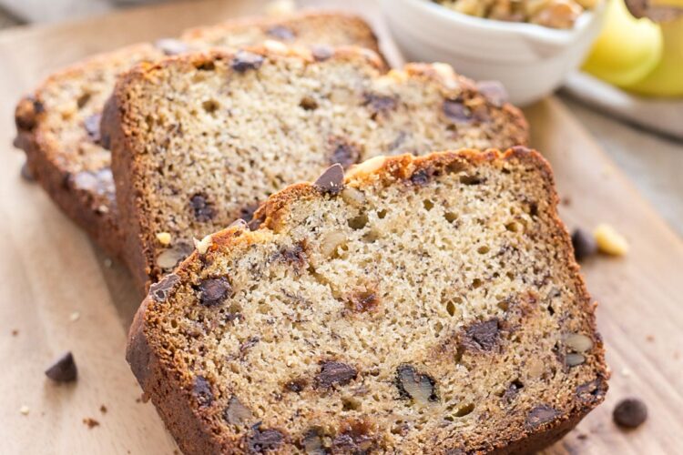 Banana bread slices on a cutting board.